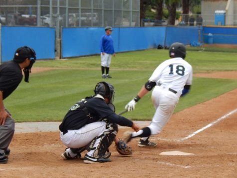 Blake Chiaramonte singles to left field and scores the winning run on Garrett Kueber's RBI hit in the ninth inning against the Cougars, Saturday.