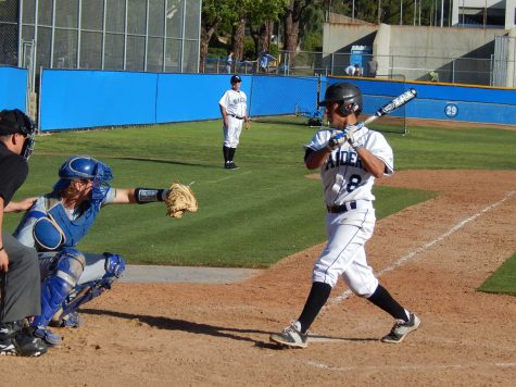 Raiders third baseman Kai Gomez spins away from a close pitch against Oxnard College, Saturday. The Condors won the game 6-4.