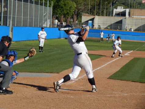 Dalton Duarte swings and misses with the bases loaded in the eighth inning against Hancock College, Thursday.