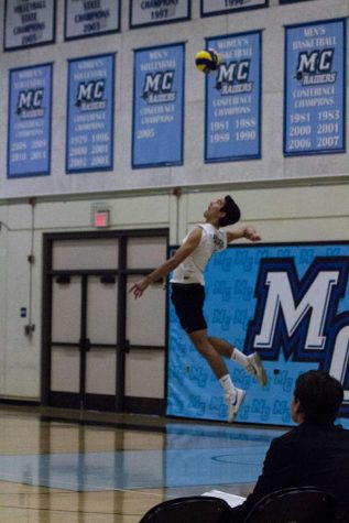JULIE FENNELL/MOORPARK COLLEGE Owen Yoshimoto (#11) of Moorpark College sends up a jump serve against SBCC in game 2 at home on Friday, April 1, 2016. Raiders took home a win of 3-1. 4-1-2016