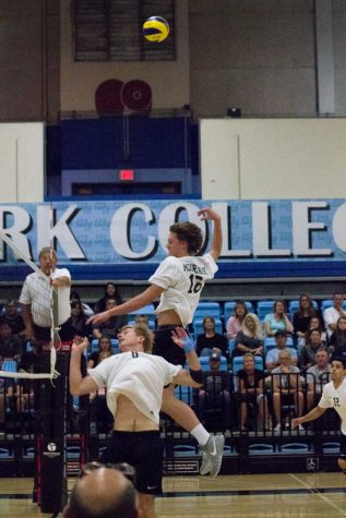 JULIE FENNELL/MOORPARK COLLEGE Andrew Hansen (#8) of Moorpark College sets up Jacob Sosa (#12), while Zach Erickson (#16) goes up to try to pull the block for SBCC in Game 4 at home on Friday, April 1, 2016. Raiders took home a win of 3-1. 4-1-2016