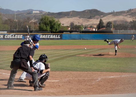 Pitcher Michael Deleon sends the ball toward opponent Hancock College in the Moorpark Baseball Field during Tuesday afternoon’s game, April 26.