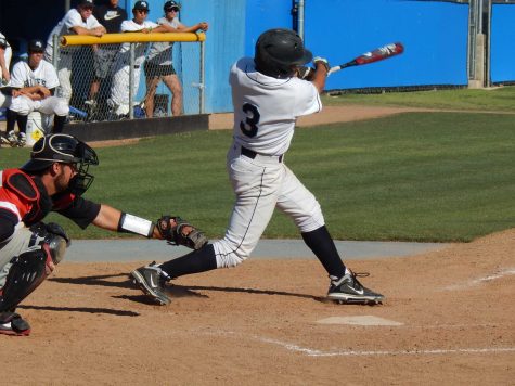 Second baseman Garrett Kueber swings and misses against Brahmas pitching. He hit a single and a double in a game the Raiders won 5-2.